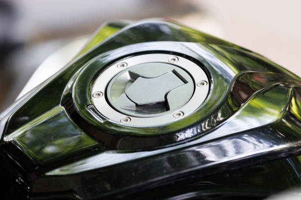 Open the motorcycle gas tank cover to refuel