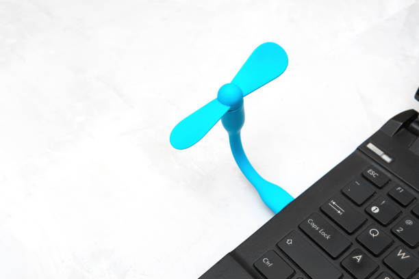 istock Flexible usb fan connected to a laptop 1401942348