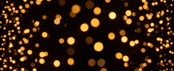 istock Defocused lights abstract bokeh background - black gold celebration party Christmas 1401942738