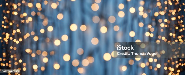 istock Defocused lights abstract bokeh background - blue gold celebration party Christmas 1401942849
