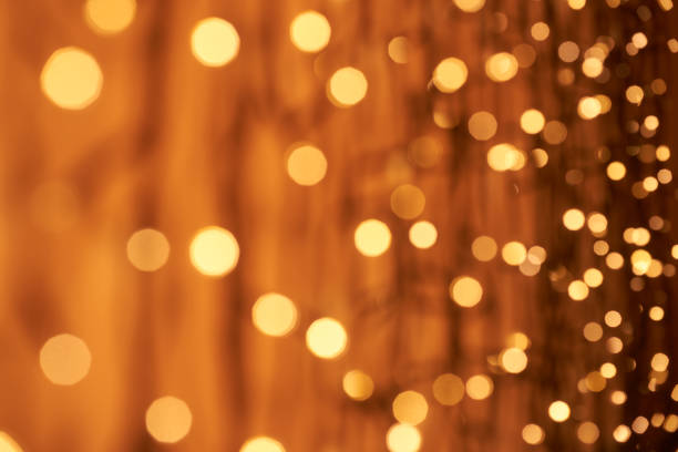 Photography of defocused lights (bokeh) in warm color tones. Great background for Websites, Christmas and many more. Native image size: 7952x5304