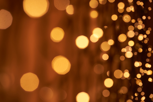 Low key photography of defocused lights (bokeh) in warm color tones. Great background for Websites, Christmas and many more. Native image size: 7952x5304