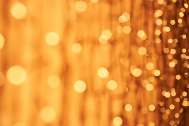 Defocused lights abstract bokeh background - orange gold celebration party Christmas stock photo