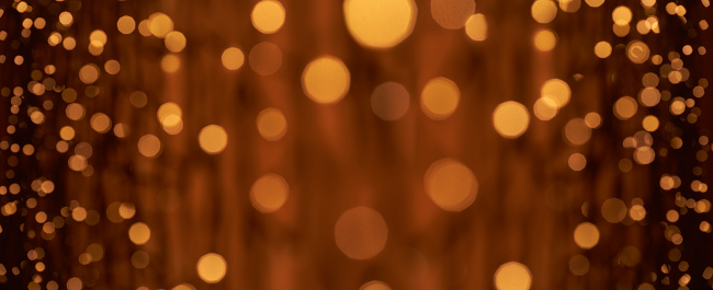 Low key photography of defocused lights (bokeh) in warm color tones. Great background for Websites, Christmas and many more. Native image size: 13000x5304