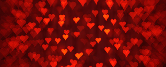 Photography of defocused lights (heart shape bokeh) in red color tones. Great background for Websites, Christmas, Valentine's Day and many more. Native image size: 13000x5304