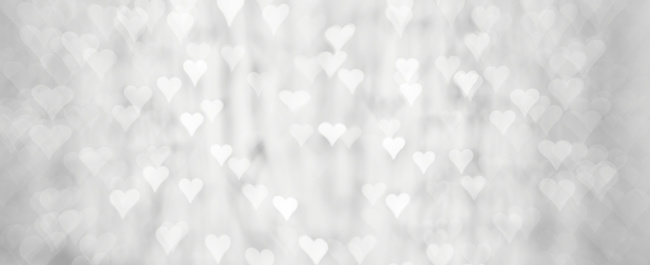 High Key photography of defocused lights (heart shape bokeh) in black and white. Great background for Websites, Christmas, Valentine's Day and many more. Native image size: 13000x5304