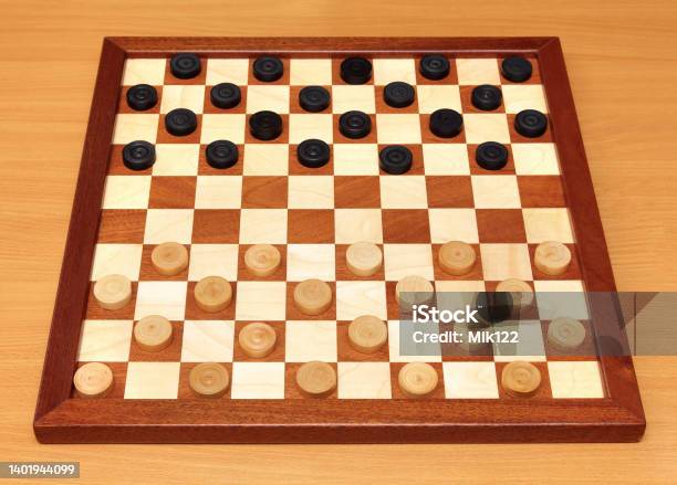 Checkerboard With Checkers Spaced Stock Photo - Download Image Now - Black Color, Board Game, Brown