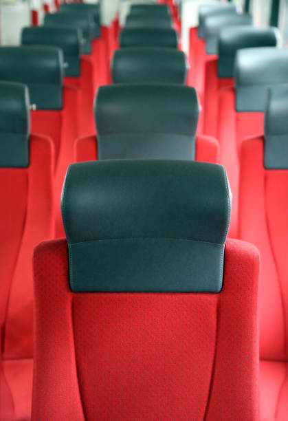 istock rows of red seats in train 1401944195