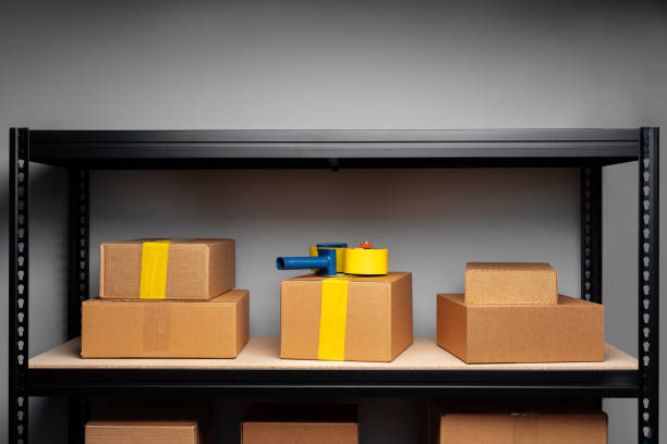 istock Rack shelves with paper boxes in warehouse. 1401945272