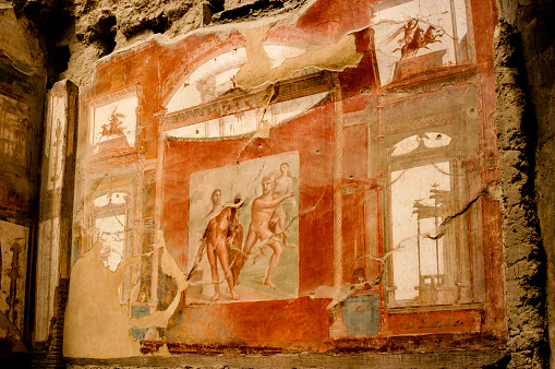 Herculaneum was buried under volcanic ash and pumice in the eruption of Mount Vesuvius in AD 79  - This wall painting depicts the contest between Hercules and the River Achelous for the hand of Deianira.