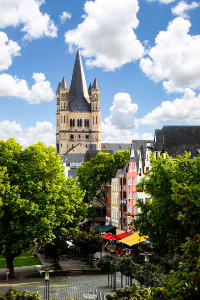 Saint Martin's Church in Cologne stand over the colorful cityscape. stock photo