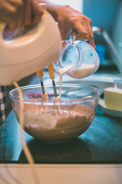 istock woman making delicious cream for cupcakes 1401948887