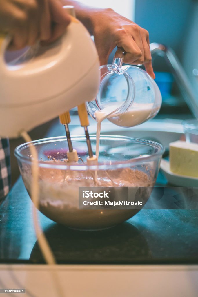 woman making delicious cream for cupcakes happy woman cooking on kitchen Adult Stock Photo