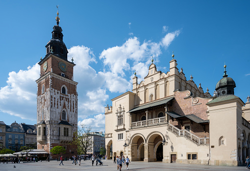 Krakow, Poland - May 9, 2022: view on historic cloth hall on main town square in Krakow under blue sky, Poland