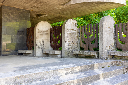 Lublin, Poland - May 24, 2022: New Jewish cemetery and modern building of Synagogue with Memorial Room. Decorative fence in the shape of a Jewish menorah