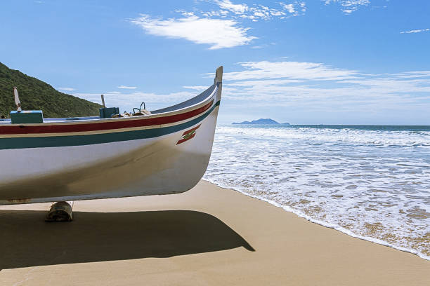 istock Fishing boat on the beach sand 1401953264