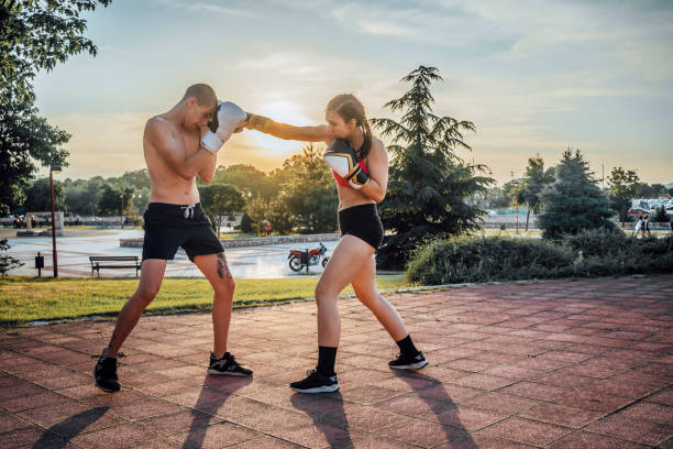 istock Man and a woman practicing kick boxing 1401953399