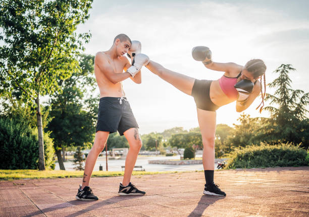 istock Female boxer sparring with her boyfriend 1401953514