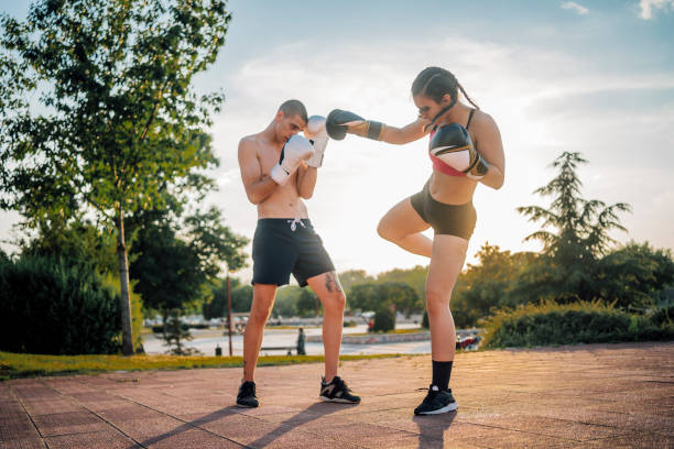 istock Couple training boxing outdoors 1401954301
