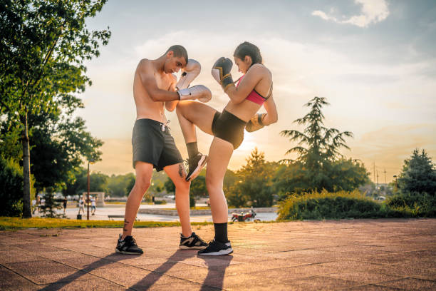 istock Couple training boxing outdoors 1401954370