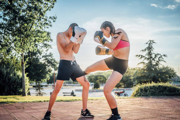 istock Man and woman boxer on training outdoor 1401954427