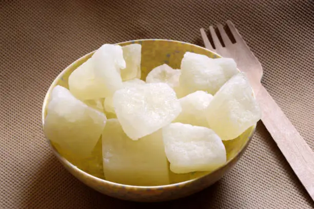 Photo of Petha, an Indian vegetarian dessert also known as Agra Petha is made out of ash gourd dunked into sugar syrup, drained and dried.