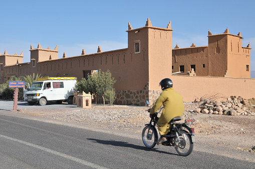 Nkob, Morocco - March 20, 2012: Road and buildings at the entrance of the town