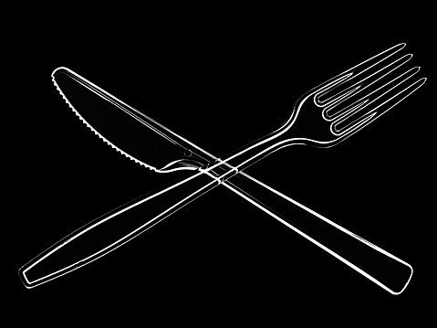 Bright cutlery, plastic knife and fork, white outline on black background.