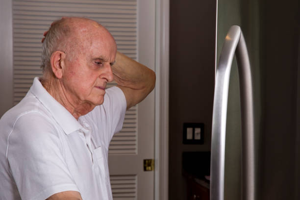 istock Senior man at home looking in refrigerator 1401962498