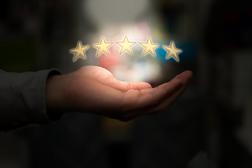 hand hold five golden rating stars show excellent service