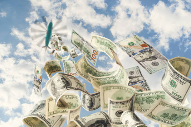 istock Helicopter money concept. 100 USD banknotes out of an open doo, selective focus 1401963995