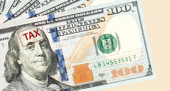 Hundred US dollar bills background border and tax closeup