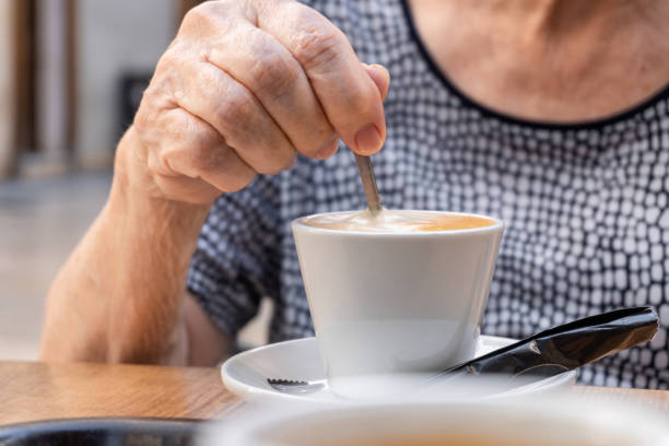 istock old woman move spoon coffee 1401965451