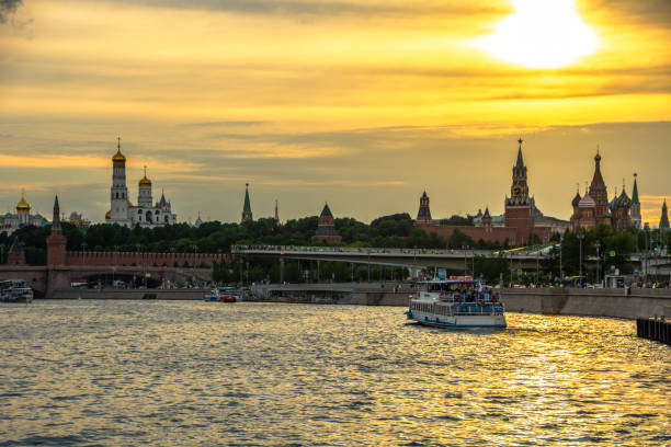 moscow, russia - june 2022: view of the zaryadye park (zaryadye inscription), st. basil's cathedral and the kremlin palace at sunset, moscow, russia. - russia moscow russia st basils cathedral kremlin imagens e fotografias de stock