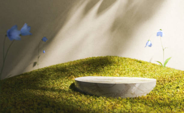 istock Marble stand on mossy ground near delicate flowers 1401972190
