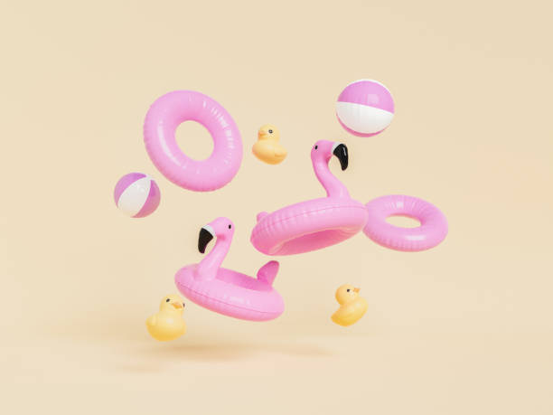 3D set of swim tubes with toys against beige background 3D rendering of pink inflatable flamingos balls and swim rings with yellow rubber ducks against beige background swimming float stock pictures, royalty-free photos & images