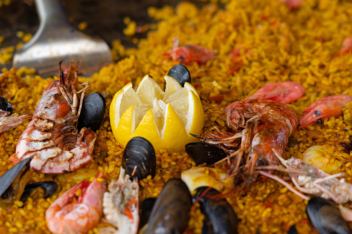 Sea food with rice and lemon mix dish with shrimps and mussels (paella)