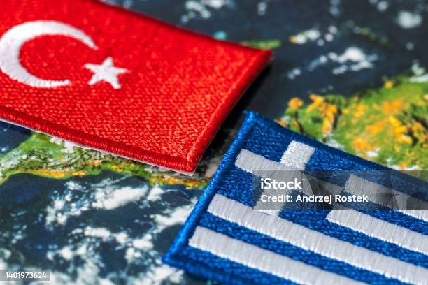Flags Of Turkey And Greece Concept Growing Conflict Between Members Of The Joint Defense Alliance Over The Militarization Of Islands In The Aegean Sea Stock Photo - Download Image Now