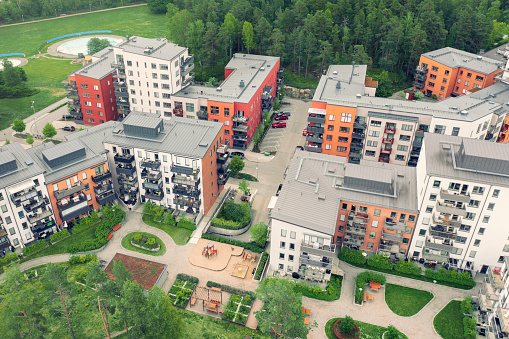 Modern apartment buildings with a park, playground and parking space in the Täby municipality outside Stockholm.