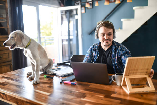 istock Dwarf Male Preparing His Work Desk Before Starting His Freelance Work From Home 1401977127