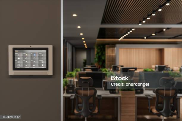 Smart Control System With App Icons On A Digital Screen In Modern Office With Blurred Background Stock Photo - Download Image Now