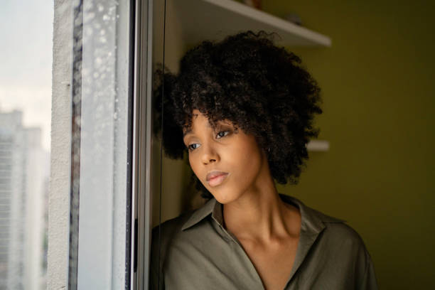 istock Woman with depression at home 1401980392