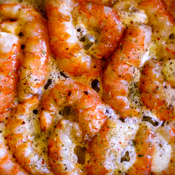 Large peeled shrimp are fried in butter with spices