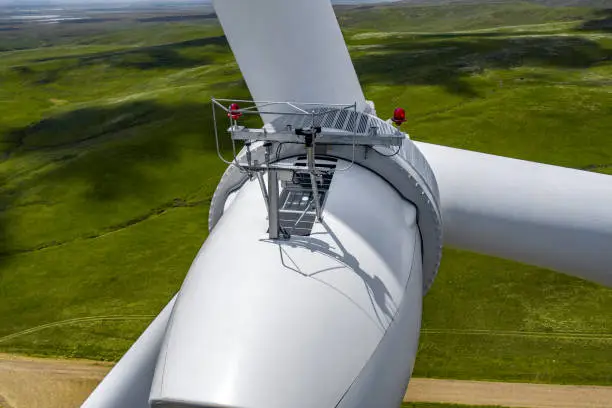 Closeup view of Wind Turbines on a Windmill Energy Farm