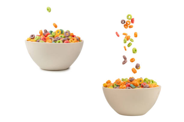 istock Colorful cereal box for morning breakfast. Corn flakes falling to the white bowl. Motion. 1401984266