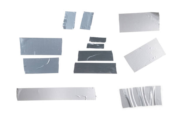 istock Silver scotch tape pieces isolated on white background. 1401984271