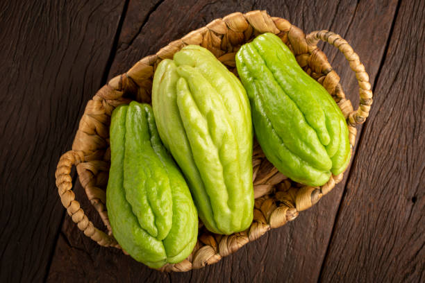 Fresh chayote fruits on the table.
