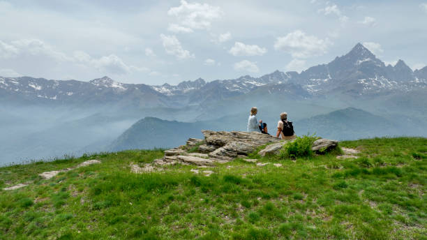 istock Mature couple relax in meadow, rehydrating 1401986373