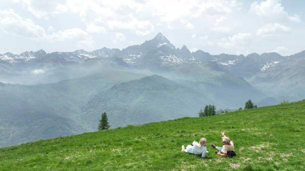 istock Mature couple relax in grassy meadow 1401987273