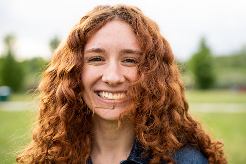 Portrait of young girl with red hair